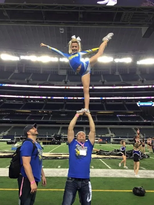 Me stunting one of my athletes at AT&T Stadium